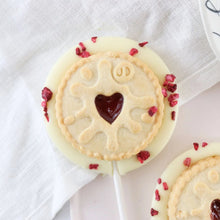 Load image into Gallery viewer, White Chocolate Jammy Dodger Lollipop - The Home Of Fully Loaded boozy Chocolate. Large Slabbs of boozy chocolate with a variety of alcoholic ganaches; gin, rum, whisky, amaretto, baileys and toppings. Available as monthly subscriptions.